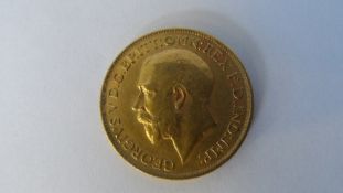 A GEORGE V 1912 GOLD FULL SOVEREIGN (GOOD CONDITION) B.P. BENEATH DRAGON B.M BENEATH THE NECK.