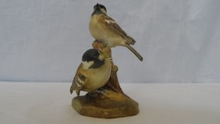 A ROYAL WORCESTER PORCELAIN GROUP OF TWO COAL TITS ON A TREE STUMP, PAINTED IN NATURALISTIC MATT