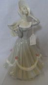 A DARTS SPANISH PORCELAIN FIGURE OF A VICTORIAN LADY, 33 cms. WITH MARKS TO BASE.