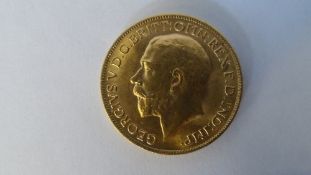 A GEORGE V 1913 GOLD FULL SOVEREIGN (GOOD CONDITION) B.P. BENEATH DRAGON B.M BENEATH THE NECK.