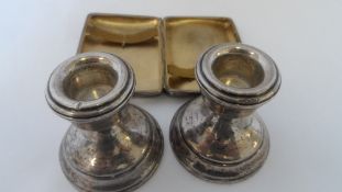 A PAIR OF BIRMINGHAM HALLMARKED TRAVELLING CANDLE STICK HOLDERS STAMPED B & CO. 6 cms H TOGETHER