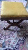 A VICTORIAN WALNUT STOOL, THE UPHOLSTERED DROP-IN TOP ON SCROLLED X-SHAPED SUPPORTS, APPROX. 51