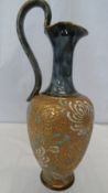 A CIRCA 1920 ROYAL DOULTON `SLATER PATENT` EWER, THE FLORAL DESIGN ON GILT TEXTURED GROUND