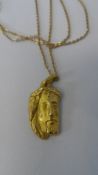 AN 18ct GOLD HALLMARKED PENDANT DEPICTING JESUS ON A 17k CHAIN, TOTAL WEIGHT 4.8 gms.