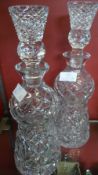 A PAIR OF CUT GLASS THISTLE TOPPED DECANTERS 33 cms H.