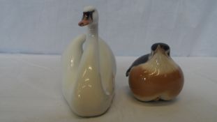 A ROYAL COPENHAGEN PORCELAIN FIGURE OF A MALE SWAN, APPROX. 10 cms HIGH TOGETHER WITH A SIMILAR
