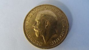 A GEORGE V 1913 GOLD FULL SOVEREIGN (GOOD CONDITION) B.P. BENEATH DRAGON B.M BENEATH THE NECK.