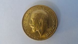 A GEORGE V 1911 GOLD FULL SOVEREIGN (GOOD CONDITION) B.P. BENEATH DRAGON B.M BENEATH THE NECK.