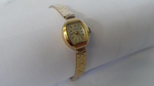 A LADY`S 9ct YELLOW GOLD RODANIA WRIST WATCH ON 9ct GOLD BRACELET. WITHOUT MOVEMENT (14.5 g)