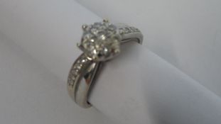 A 9ct WHITE GOLD HALLMARKED DIAMOND RING