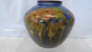 A ROYAL DOULTON VASE CIRCA 1923-1927 - FLORAL DESIGN ON BLUE GROUND, IMPRESSED MARKS TO BASE, ARTIST