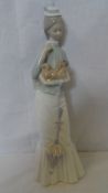 A LLADRO PORCELAIN FIGURE `WALK WITH THE DOG’, 38 cms WITH IMPRESSED MARKS TO BASE.