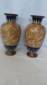 A PAIR OF ROYAL DOULTON STONE WARE VASES `SLATERS PATENT`, CENTRAL FLORAL DESIGNS ON TEXTURED GILT