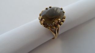 A 9ct GOLD LADY`S RING SET WITH A SMOKY TOPAZ SIZE O 4.4 grams