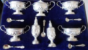 A SOLID SILVER BIRMINGHAM HALLMARKED ADAMS STYLE CRUET SET M.M H M 1904, COMPRISING OF FOUR TWIN