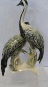 A PORCELAIN FIGURE OF TWO CRANES HAVING 7513 TO BASE, APPROX. 27 cms
