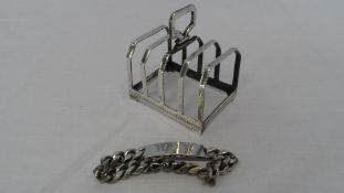 A SOLID SILVER SHEFFIELD HALLMARKED TOAST RACK TOGETHER WITH A SILVER IDENTITY BRACELET ( 2 )