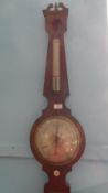 AN ANTIQUE MAHOGANY CASED BAROMETER WITH IVORY TURNED KNOB APPROX 19 cms (d)