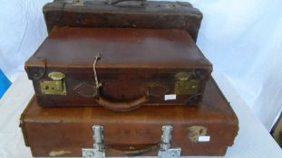 THREE MISC VINTAGE GENTLEMAN`S LEATHER SUITCASES, ONE STAMPED HARRODS. (3)