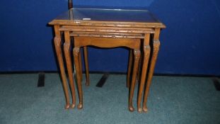 A MAHOGANY NEST OF TABLES.