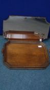 A MAHOGANY FOLDING CAMPAIGN TABLE TOGETHER WITH A SHAPED OAK TRAY WITH TURNED WOOD AND BRASS