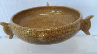 A CHINESE CRACKLE GLAZE SERVING VESSEL WITH THREE APPLIED HANDLES 15 cms D x 5 cms H.