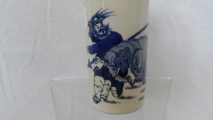 A CHINESE BLUE AND WHITE BRUSH POT DEPICTING A WARRIOR AND ELEPHANT, ARTEMISIA LEAF TO THE BASE,