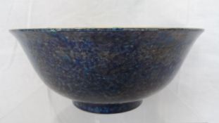 A DEEP BLUE CHINESE PORCELAIN BOWL DEPICTING DRAGONS AMONGST CLOUD SCROLLS AND FLAMING PEARLS OF