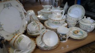 A PART NORITAKE TEA SET COMPRISING SIX CUPS AND SAUCERS, SIX CAKE PLATES AND ONE SANDWICH PLATE