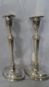 A PAIR OF SHEFFIELD HALLMARKED SILVER CANDLESTICKS, APPROX. 23 cms HIGH, DATED 1906.