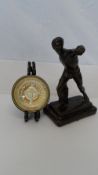 A BRONZE FINISHED FIGURE OF AN ATHLETE TOGETHER WITH A BRASS AND LEAD PAPERWEIGHT IN THE FORM OF A