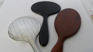 THREE MISCELLANEOUS HAND MIRRORS INCLUDING A BIRMINGHAM SILVER HALLMARKED MIRROR. (3)