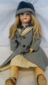 AN ARMAND MARSEILLE PORCELAIN HEADED DOLL INSCRIBED 390 A 8 M MADE IN GERMANY, HAVING JOINTED ARMS