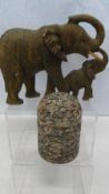 A CARVED STONE FIGURE OF AN ELEPHANT AND HER CALF, APPROX. 28 X 20 cms TOGETHER WITH A CARVED