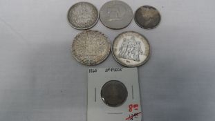 A COLLECTION OF MISC. SILVER COINS INCLUDING M. TERESA COIN, MIDDLE EASTERN COIN, FIFTY FRANCS COIN.