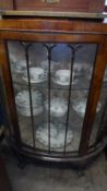 A VICTORIAN BOW FRONTED MAHOGANY DISPLAY CABINET