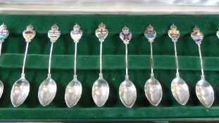 A SET OF TEN STERLING SILVER AND ENAMEL CANADIAN COMMEMORATIVE SPOONS DEPICTING VARIOUS PROVINCES IN