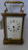 A BRASS CARRIAGE CLOCK HAVING FRENCH MOVEMENT - CURTIS & HORSPOOL - LEICESTER.