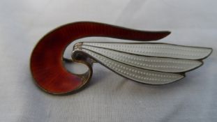 A NORWEGIAN SILVER AND ENAMEL ART DECO BROOCH IN THE FORM OF A WING