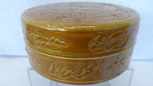 A CHINESE MUSTARD YELLOW LIDDED SERVING DISH, THE LID DEPICTING A DRAGON AMONGST FLAMING PEARLS OF