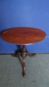 A MAHOGANY OVAL WINE TABLE ON TRIPOD BASE - APPROX. 58 X 58 X 42 cms