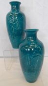 A PAIR OF CHINESE TURQUOISE GLAZED VASES DEPICTING FISHERMEN CASTING NETS IN RELIEF, THE VASE HAVING