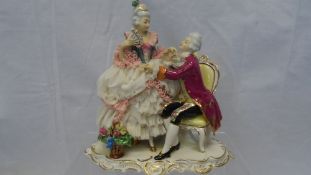 A DRESDEN DECOR GALANTERI PORCELAIN FIGURE OF TWO LOVERS AND A HAND PAINTED DRESDEN STYLE VASE