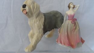 A ROYAL DOULTON POTTERY FIGURE OF AN ENGLISH SHEEPDOG TOGETHER WITH A COALPORT FIGURINE ‘SPRINGTIME’