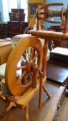 A PINE SPINNING WHEEL WITH FOUR BOBBINS 86 X 50 cms