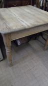 A SMALL PINE FARMHOUSE TABLE FITTED WITH ONE DRAWER ON TURNED LEGS, APPROX. 88 X 86 X 74 cms