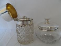 A LONDON HALLMARKED SILVER TOPPED CUT GLASS DRESSING TABLE  BOTTLE WITH ORIGINAL STOPPER TOGETHER