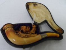 AN ANTIQUE AMBER AND MEERSCHAUM PIPE DEPICTING TWO DEER RUTTING IN ORIGINAL BOX, APPROX. 14 CM