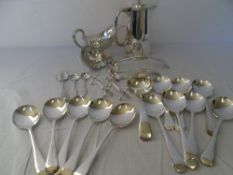 A COLLECTION OF MISC SILVER PLATE INCLUDING COFFEE POT, GRAVY BOAT, SPOONS, LADLE AND KNIFE RESTS.
