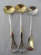 A COLLECTION OF THREE MISCELLANEOUS SOLID SILVER EXETER HALLMARKED MUSTARD SPOONS - TWO M.M H.S.E